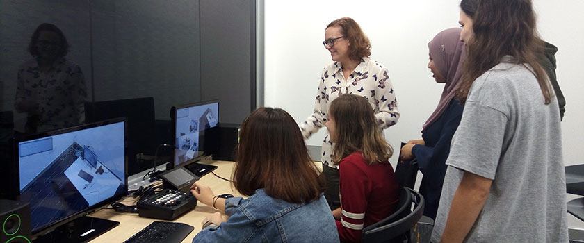 Psychology students at UoRM in a lab session with their lecturer